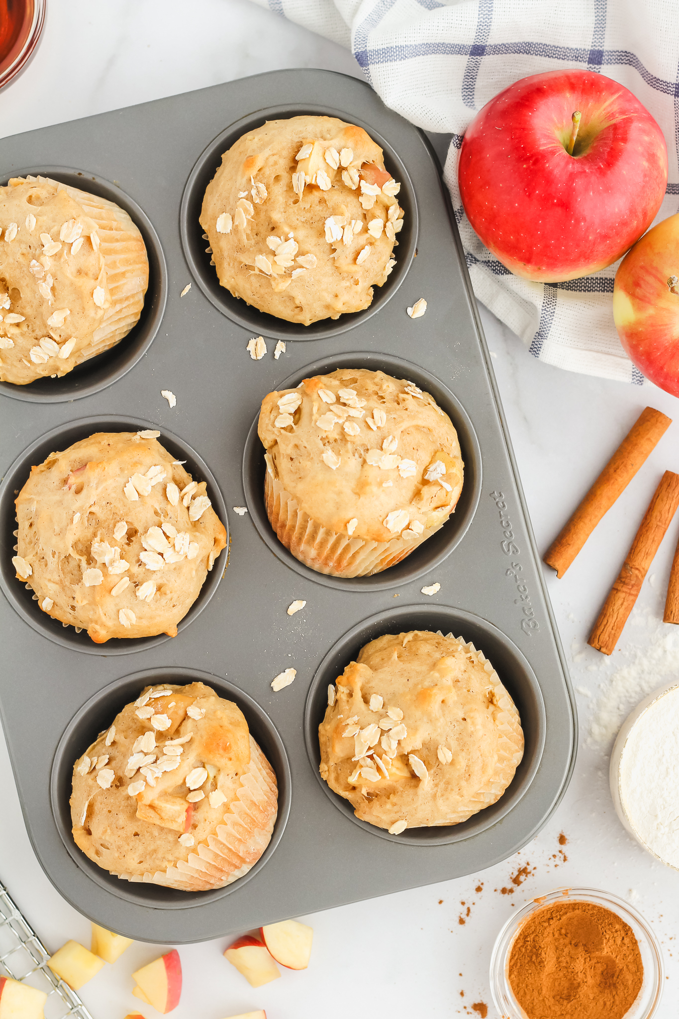 apple cinnamon oatmeal muffins in a muffin tin