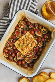 Easy Baked Feta with Balsamic Figs & Grapes Appetizer baked feta with figs in a baking dish