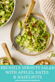 brussels sprouts salad on side plates with hazelnuts, dates and apples