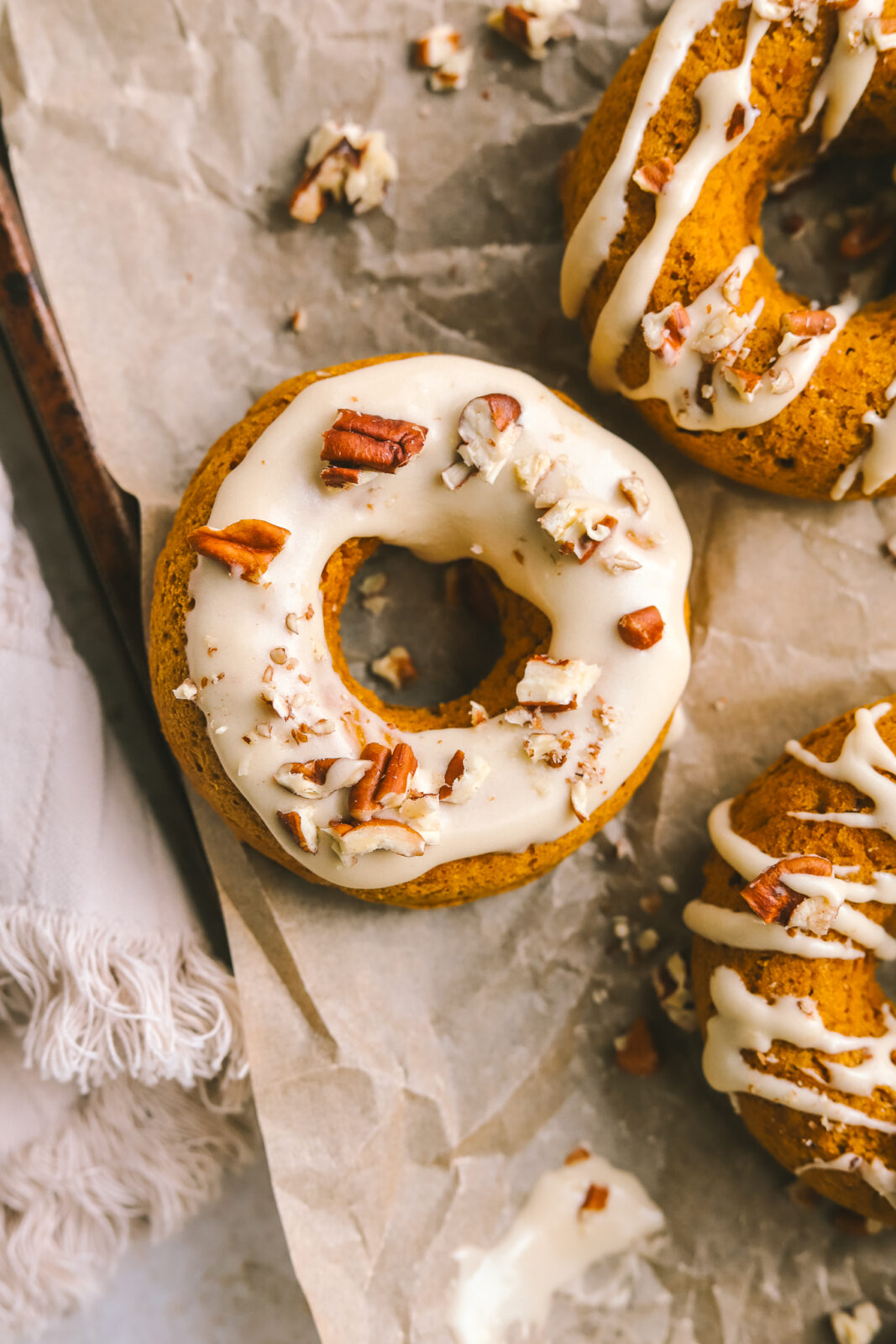 close up of 2 ingredient donut with maple icing and pecans