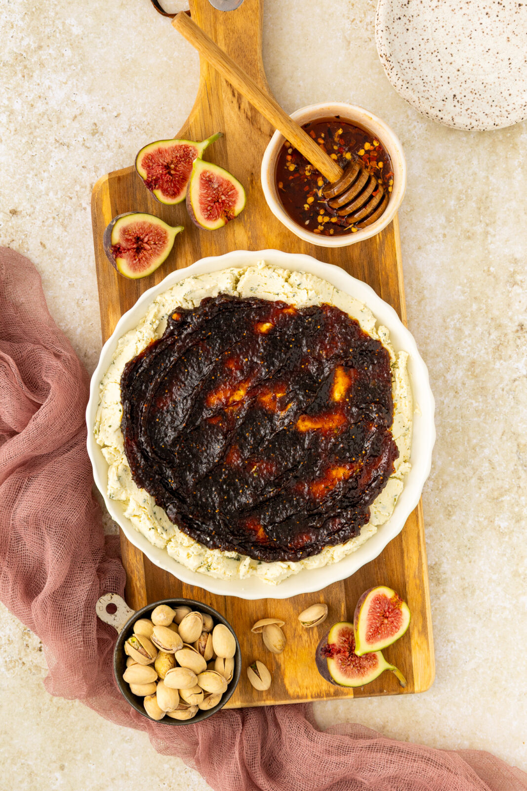boursin cheese and fig jam spread on a serving plate
