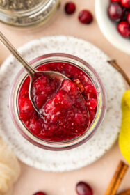 close-up of chia cranberry pear jam on a spoon