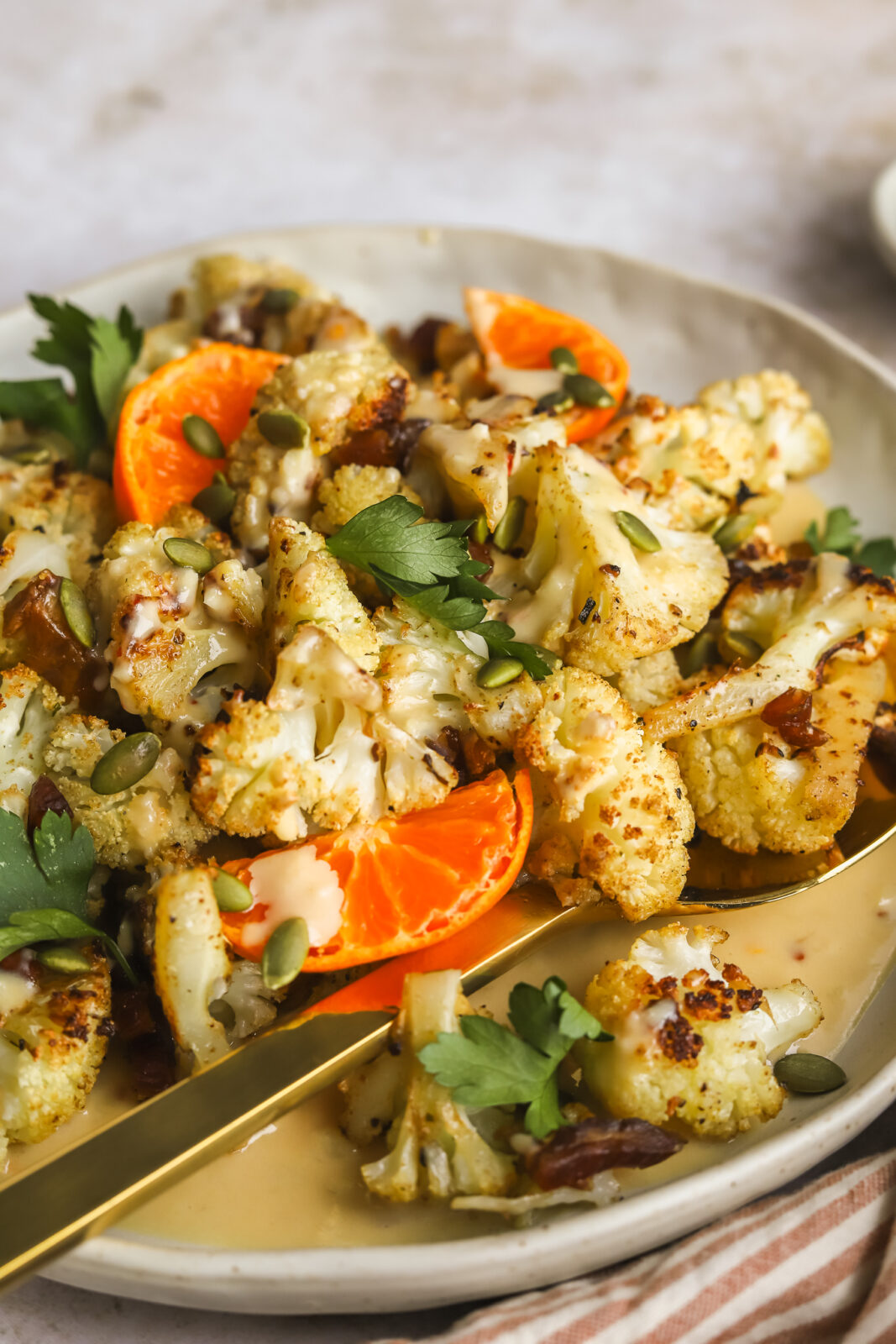 close up of roasted cauliflower on a serving plate