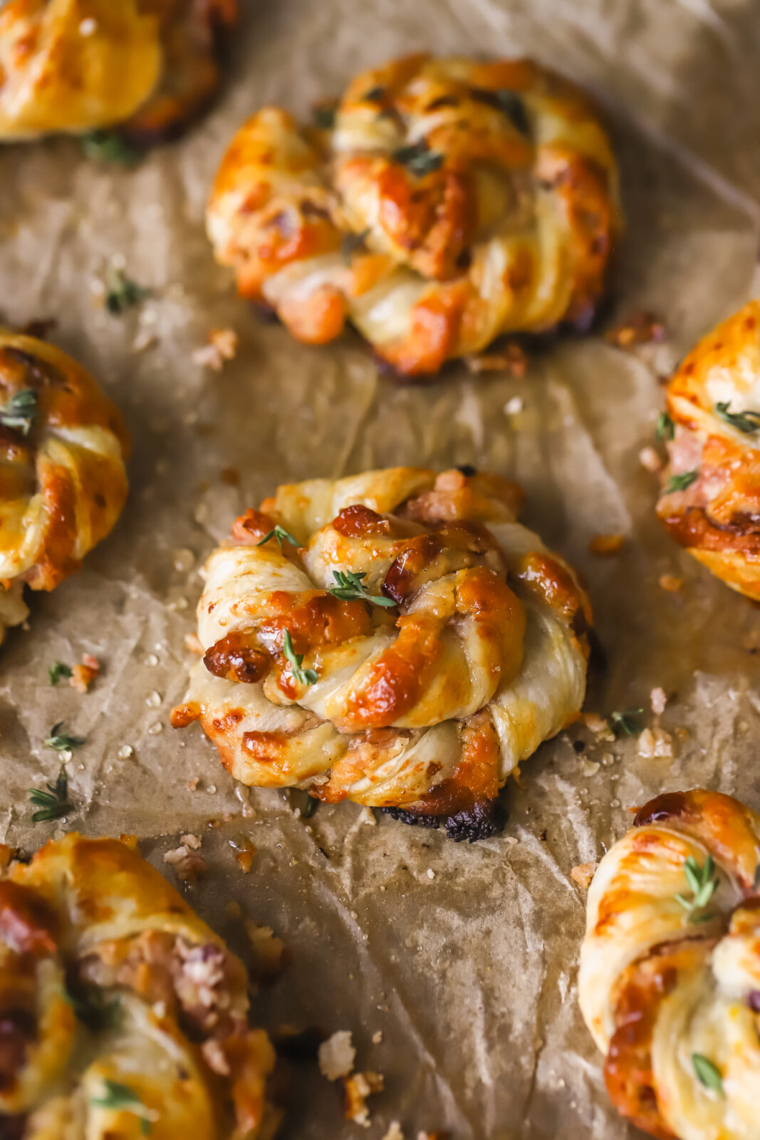fully baked cranberry goat cheese puff pastry swirls on a baking sheet
