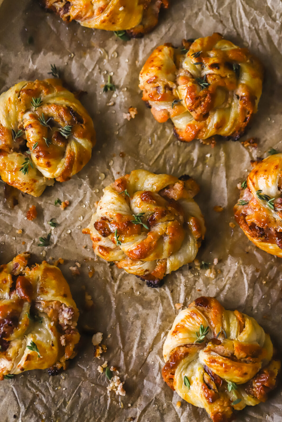 fully baked cranberry goat cheese puff pastry swirls on a baking sheet