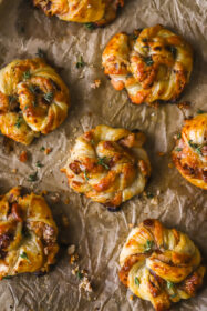 Easy Cranberry Goat Cheese Puff Pastry Swirls fully baked cranberry goat cheese puff pastry swirls on a baking sheet