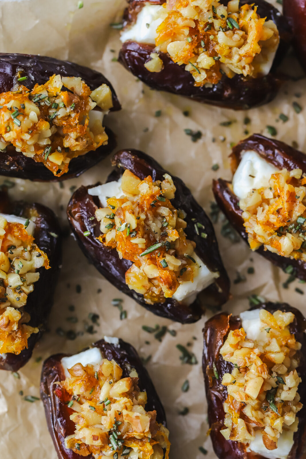 closeup shot of roasted feta stuffed dates topped with walnuts