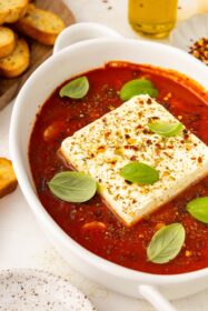 side angle of baked feta in marinara