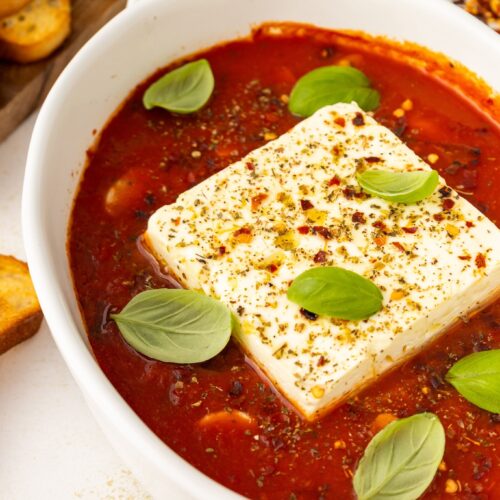side angle of baked feta in marinara