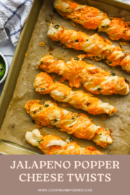baked jalapeno popper cheese twists on a baking sheet