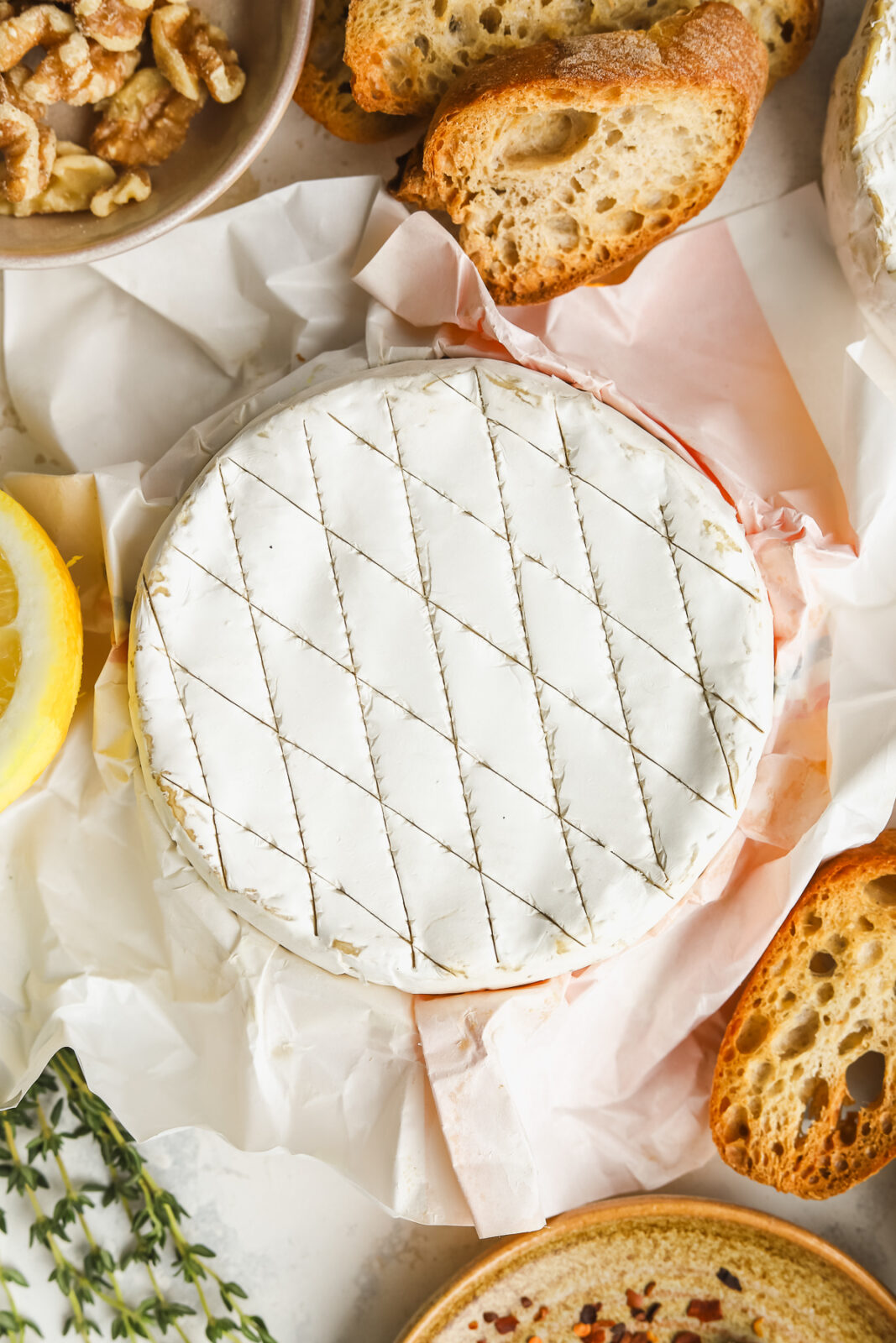 close up of a camembert cheese wheel with a crosshatch pattern