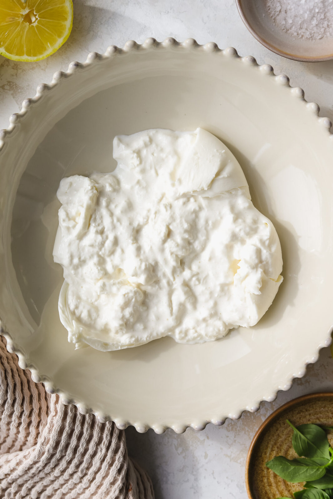 burrata pulled apart in a bowl