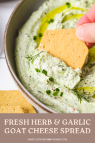 cracker dipping into a goat cheese spread recipe