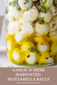 close up of mozzarella balls marinated in olive oil and herbs