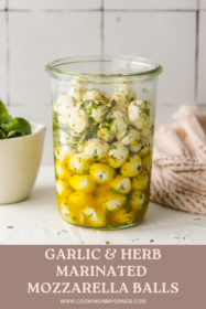 large glass jar with marinated mozzarella balls