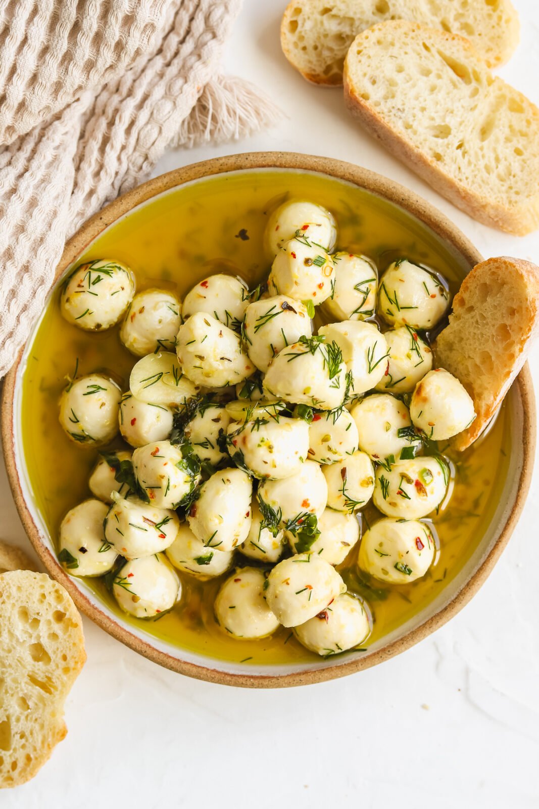 marinated mozzarella balls in a shallow bowl