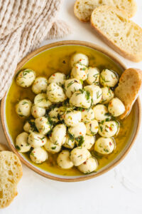 marinated mozzarella balls in a shallow bowl
