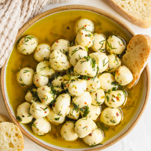 marinated mozzarella balls in a shallow bowl