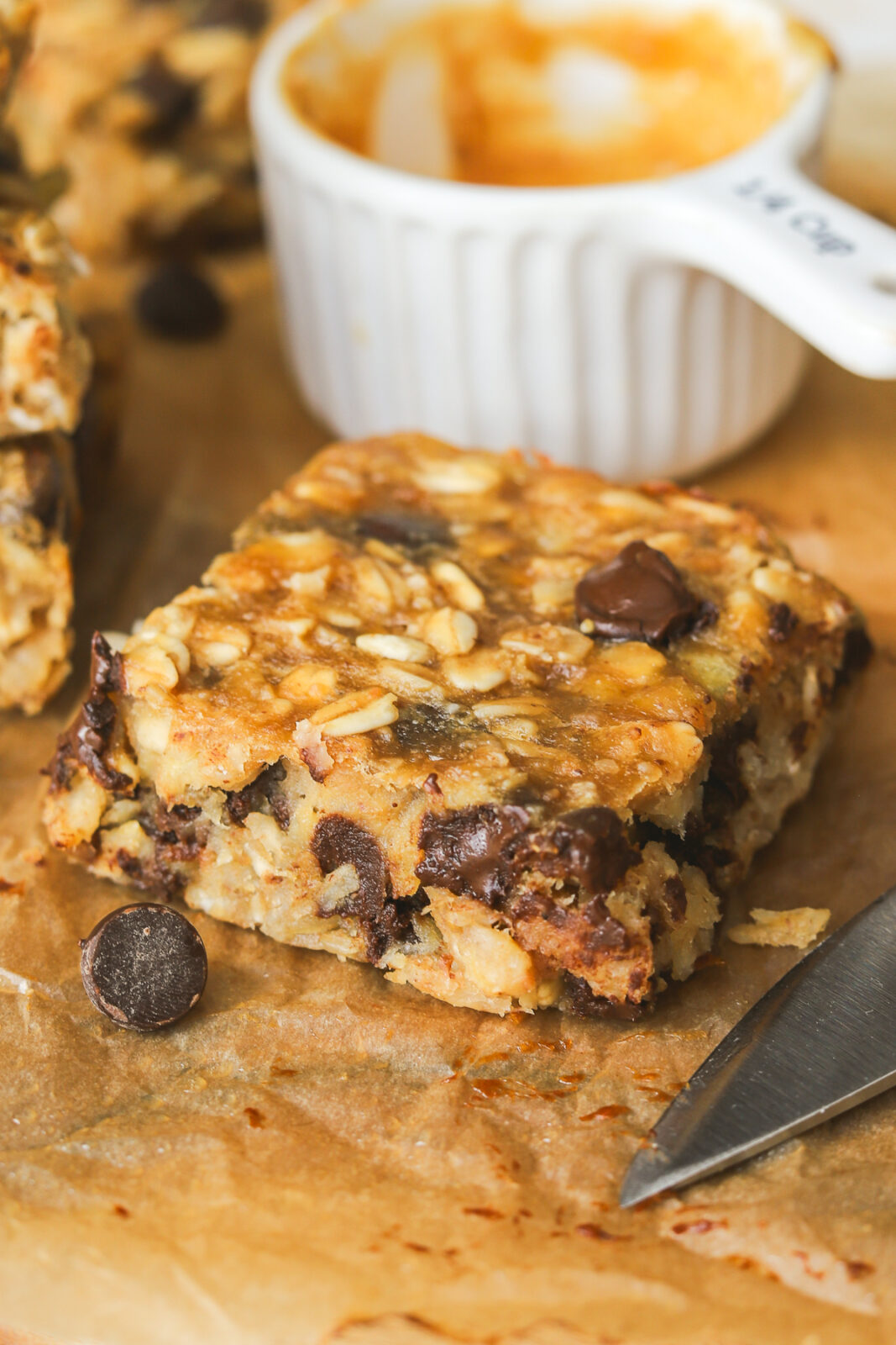 angled close up of an oat snack bar with chocolate chips
