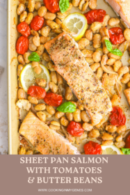 close up of a sheet pan with burst tomatoes, butter beans and salmon fillets