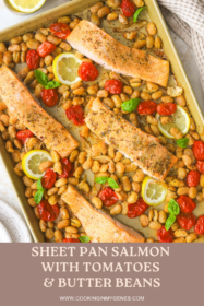 a sheet pan with burst tomatoes, butter beans and salmon fillets