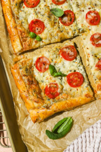 a piece of tomato and cheese tomato tart