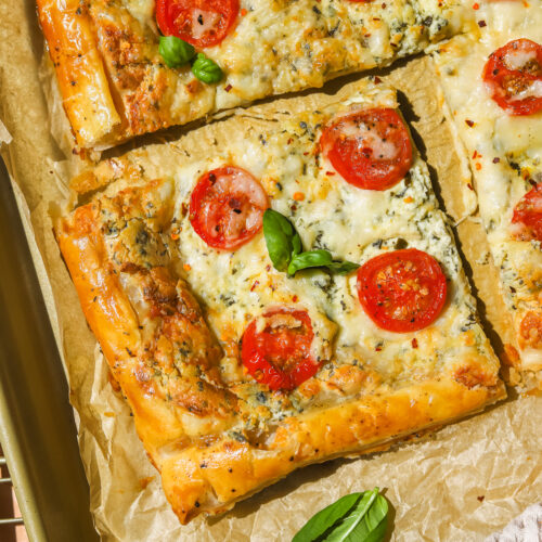 a piece of tomato and cheese tomato tart