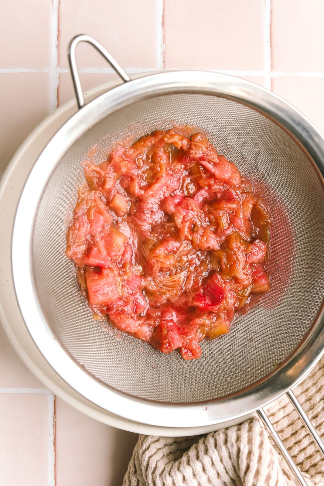 cooked rhubarb in a sieve
