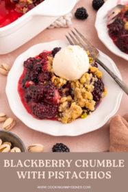 blackberry crumble on a plate with a scoop of ice cream