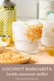 coconut margarita in a glass garnished with toasted coconut