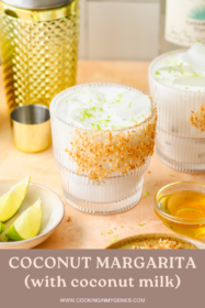 angled photo of a coconut margarita in a toasted coconut rimmed glass