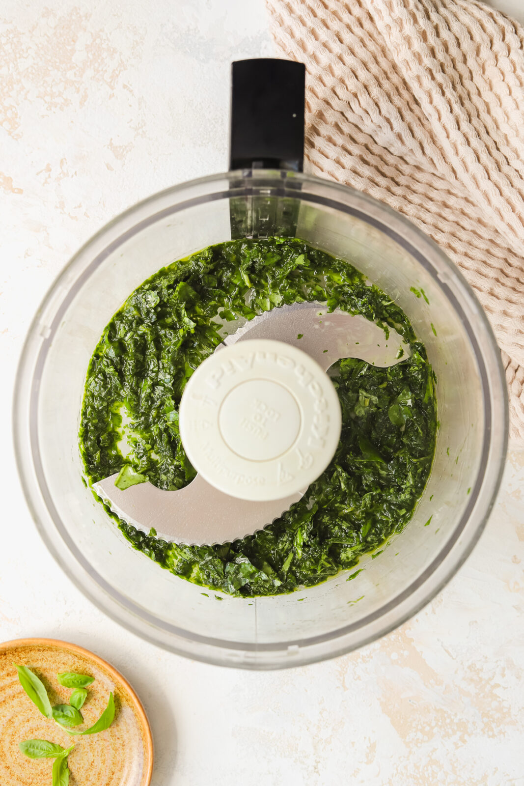 finely chopped fresh basil in a food processor