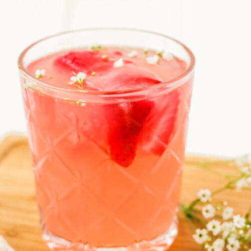 glass of strawberry rose lemonade cocktail
