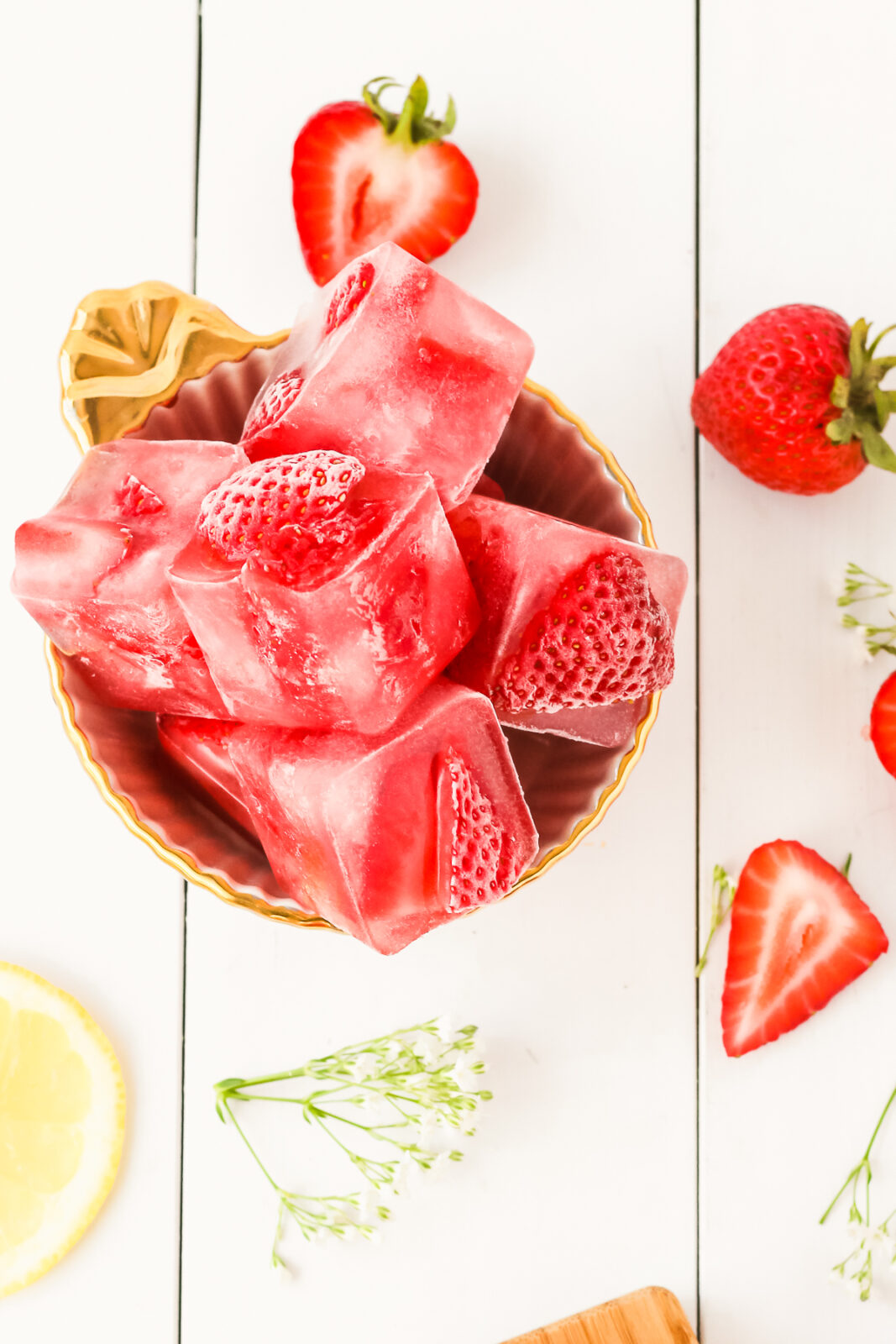 strawberry ice cubes in a bowl