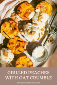 close up of grilled peach halves and scoops of vanilla ice cream on a plate