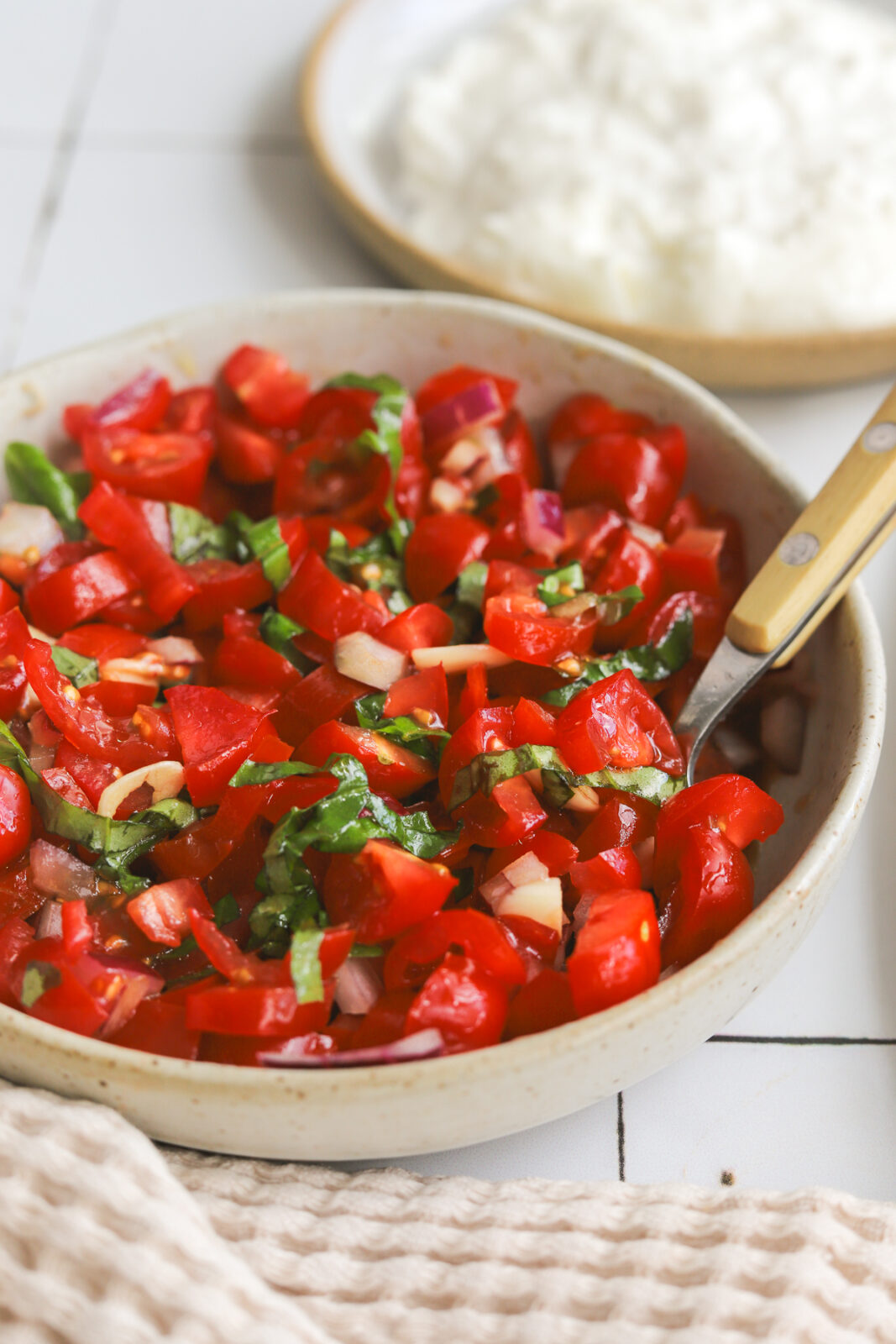bruschetta in a bowl with a spoon