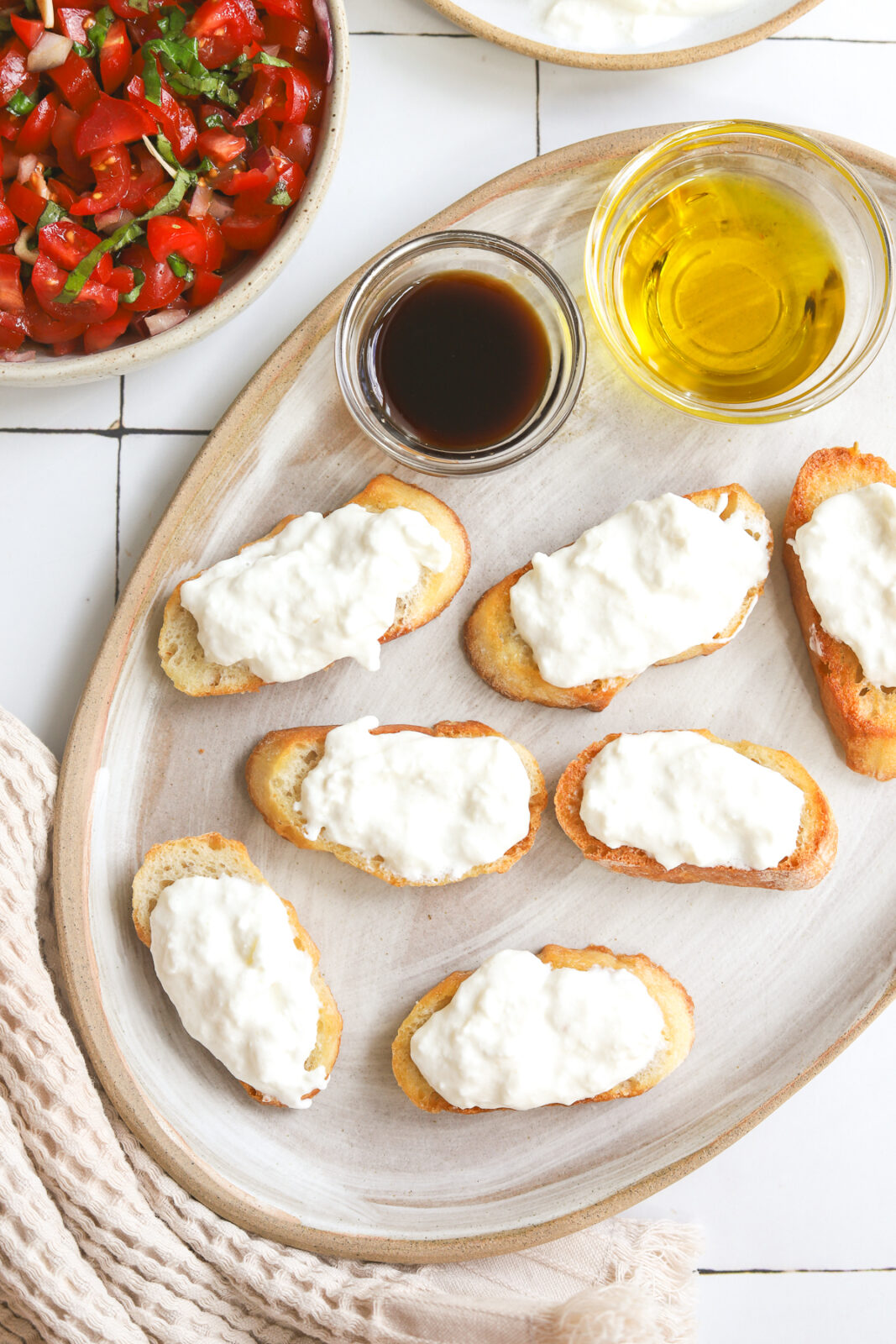 crostini with burrata on it