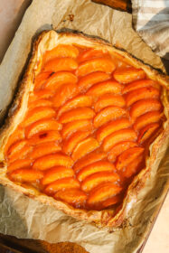 Quick & Easy Puff Pastry Apricot Tart (beginner friendly!) puff pastry apricot tart on a baking sheet