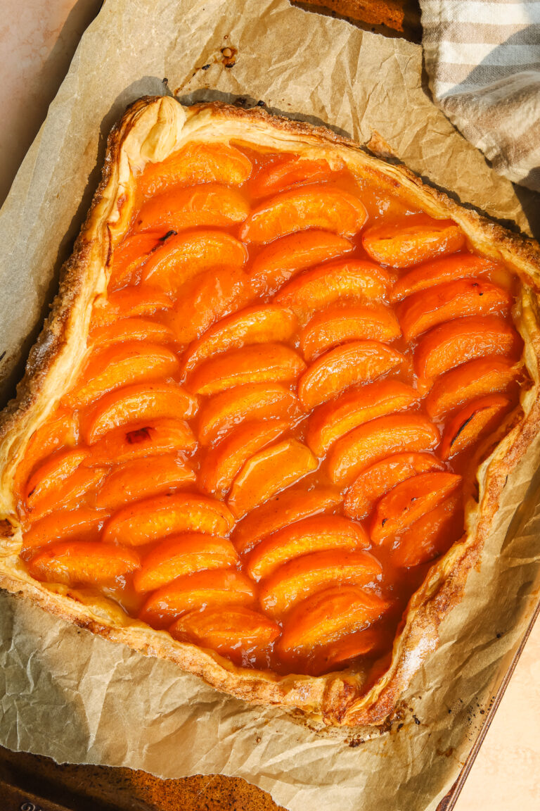puff pastry apricot tart on a baking sheet