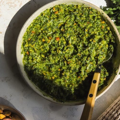 pistachio pesto in a bowl with a spoon