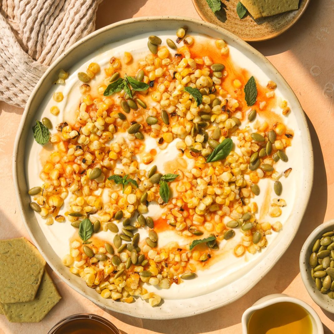 whipped feta with hot honey, corn and fresh herbs