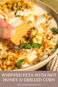 cracker scooping whipped feta with hot honey and charred corn
