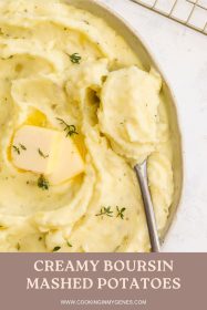a spoonful of mashed potatoes sitting in a bowl