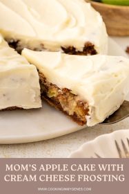 a cut piece of apple cake being pulled out from the cake platter