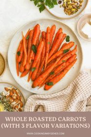 whole roasted carrots on a serving dish garnished with mint