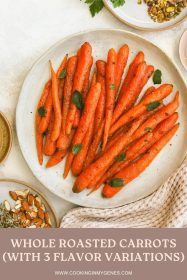 whole roasted carrots on a serving dish garnished with mint