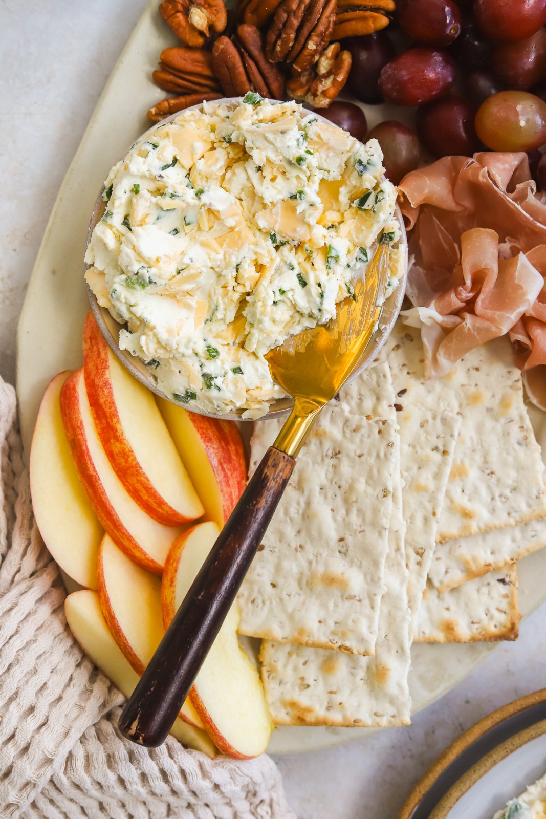 gouda cream cheese spread in a bowl on a cheese board