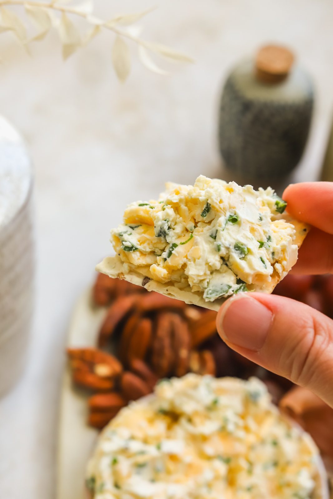 cracker with gouda cream cheese spread on top