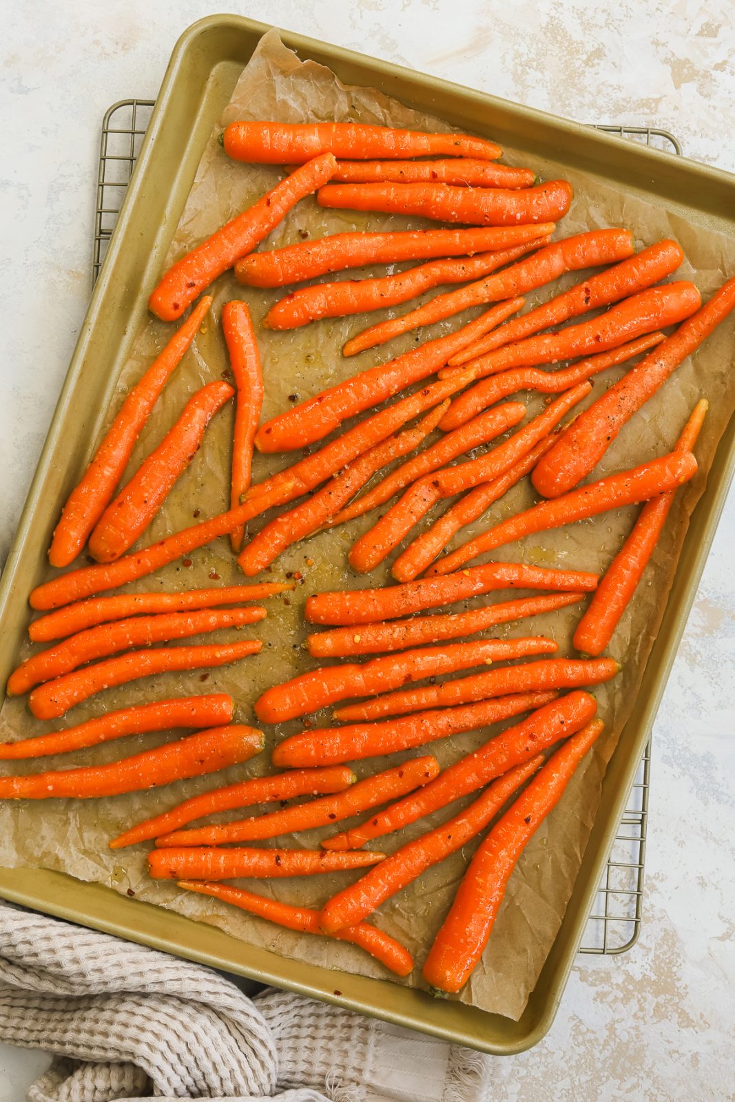 whole carrots on a baking sheet before going in the oven