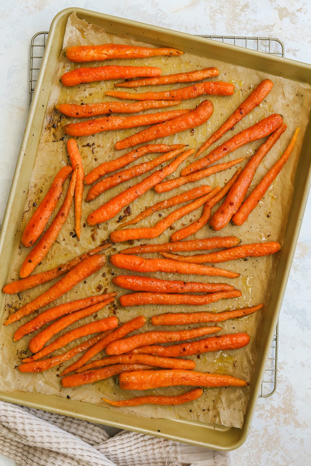 roasted whole carrots on a baking sheet